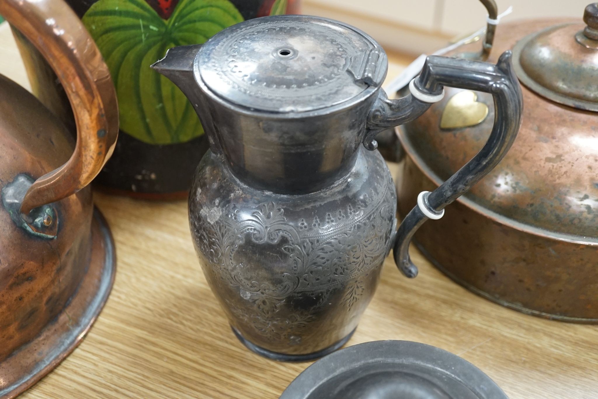 A Copper love token kettle, Georgian copper haystack measure, liberty & Co pewter teapot and a decorative papier mache bucket.